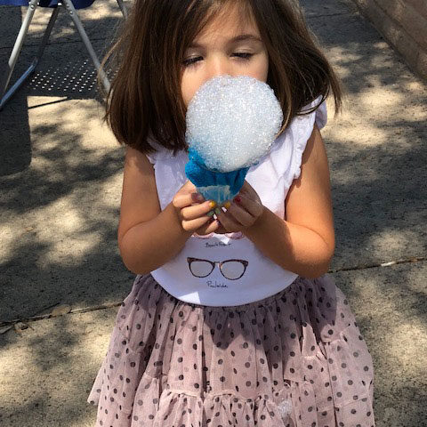 little girl enjoying bubbles