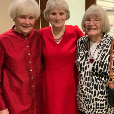 Honoree Joanne surrounded by her two sisters