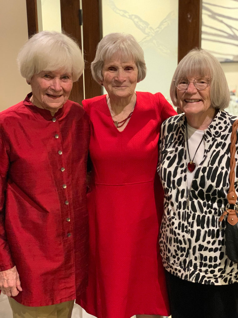 Honoree Joanne surrounded by her two sisters