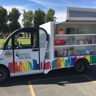 Monrovia Reads Van at Monroe Park with the side open to show books