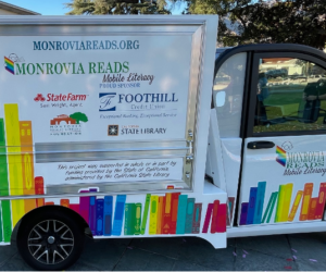 Side picture of the Monrovia Reads van with Titles and sponsors