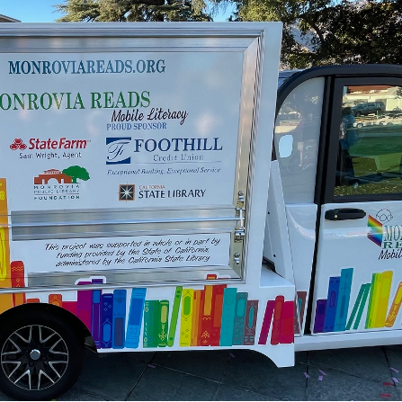 Side picture of the Monrovia Reads van with Titles and sponsors