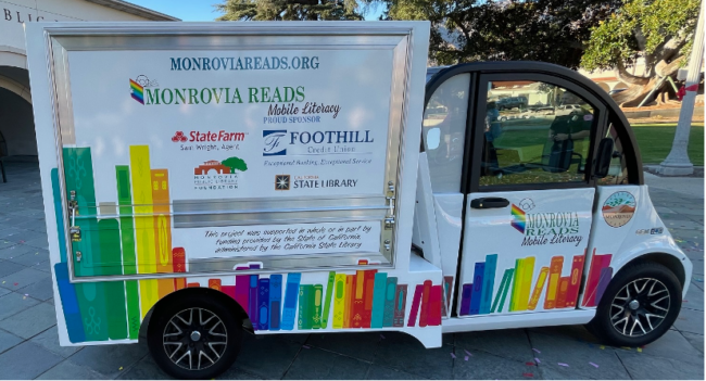 Picture1 Side picture of the Monrovia Reads van with Titles and sponsors