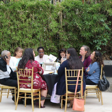 People seating at a table talking
