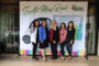 The staff of Foothill Credit Union posing in front of banner