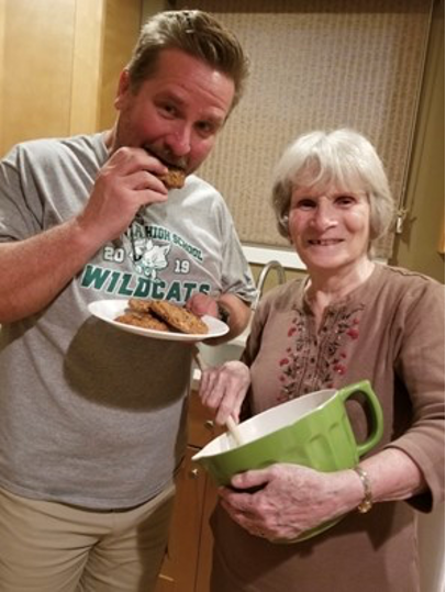 Randy and Joanne Spring holding chocolate chip cookies