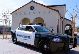 Movrovia police car in front of the Monrovia Library.