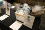 Monrovia High School auction items on a table.