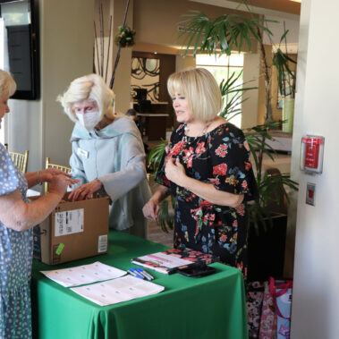 Checking in area with three ladies pictured.